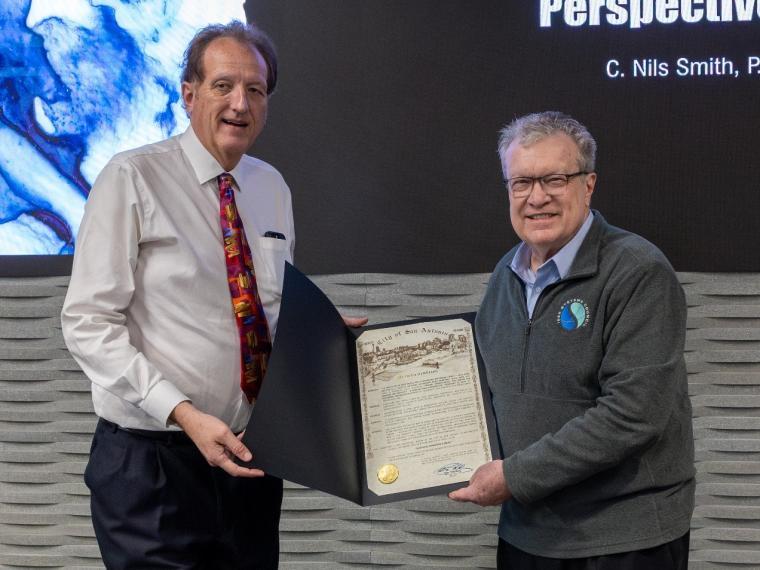 Nils Smith and Walt Downing display the City of San Antonio proclamation presented to IEEE.